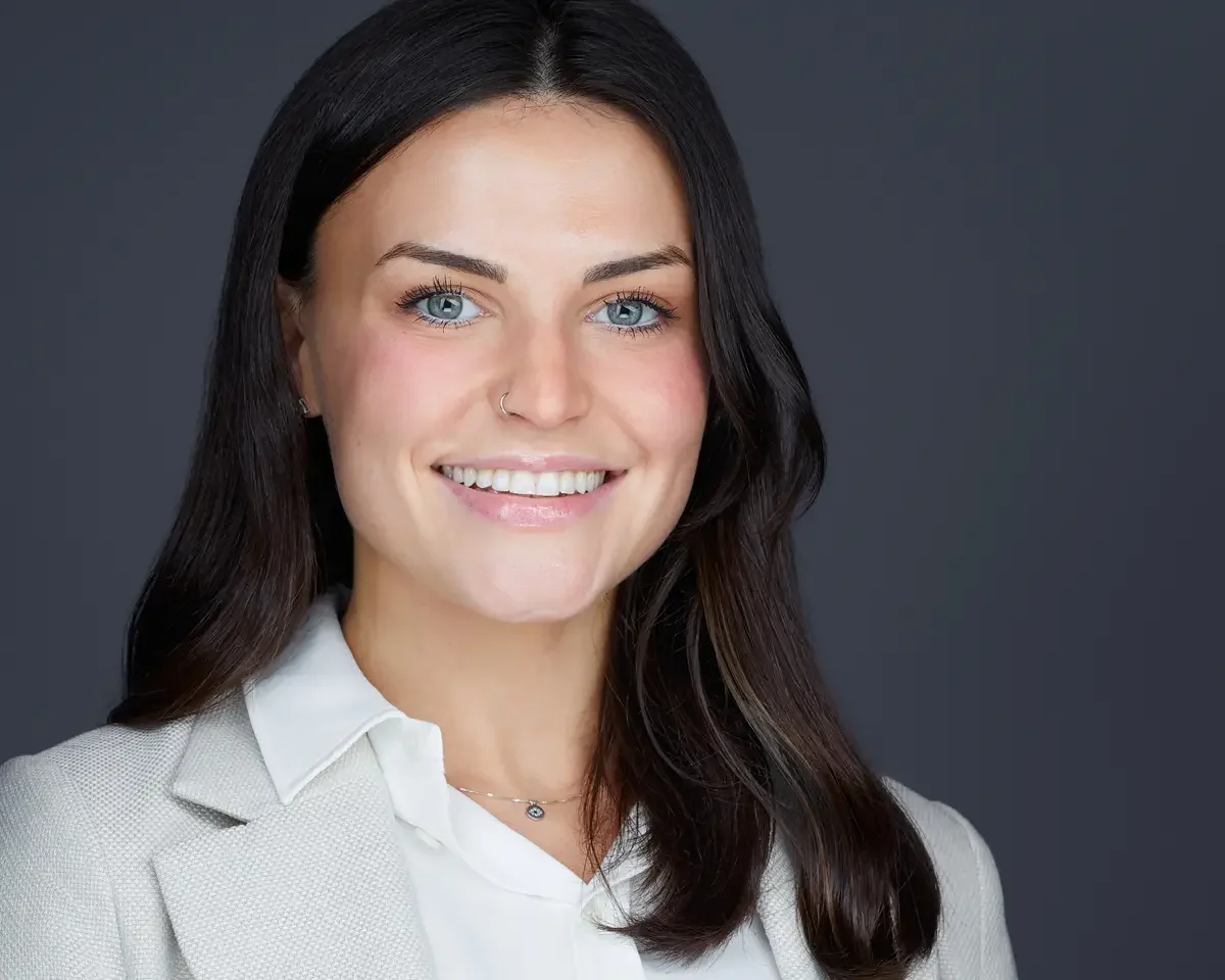 Executive portrait, white blazer and white shirt, direct confident expression, gray background, Connecticut, photographed by Scott Parker Photo