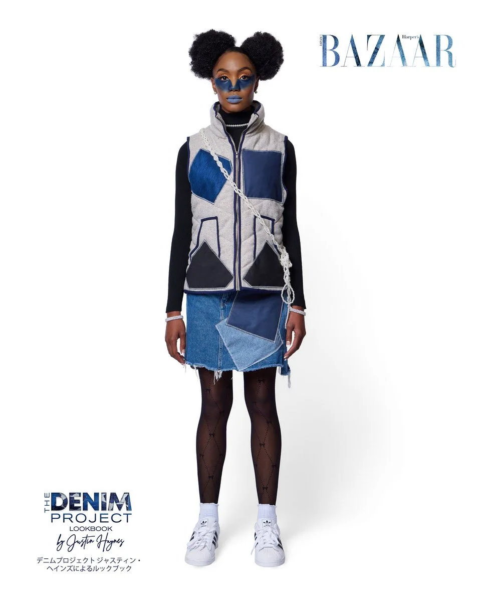 JUS10H Denim Project 2025 Harper's Bazaar Japan lookbook — model in grey and navy geometric patchwork zip-front puffer vest over black long-sleeve top, raw-hem light-wash patchwork denim mini skirt, patterned sheer tights, pearl crossbody bag, Adidas