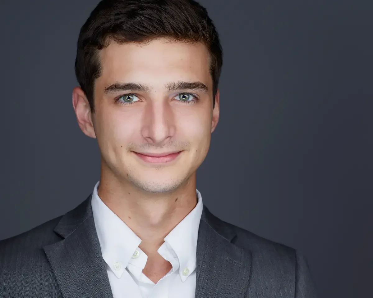 Corporate executive headshot, gray blazer and white shirt, relaxed professional expression, gray background, Greater Hartford Connecticut, photographed by Scott Parker Photo