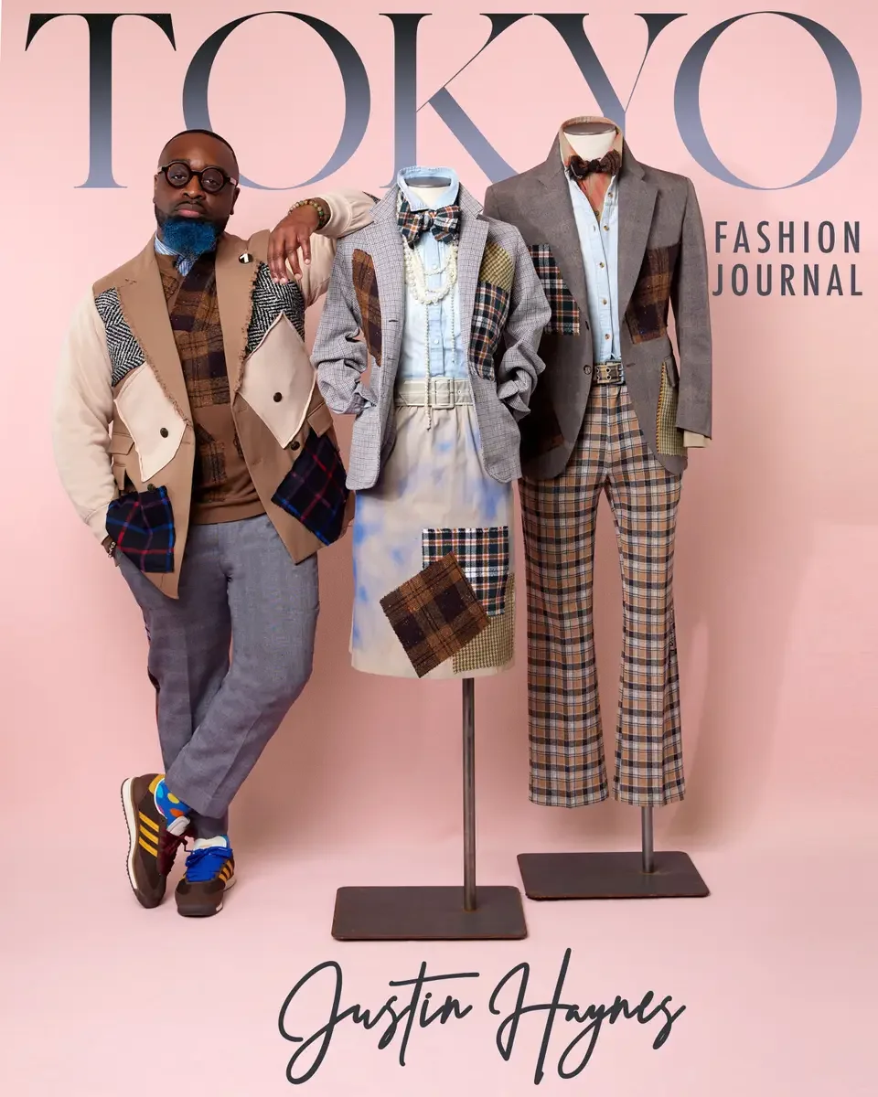 JUS10H 2025 Tokyo Fashion Journal feature, editorial cover, designer with two dressed mannequins in patchwork tailoring, neutral pink background, photographed by Scott Parker Photo