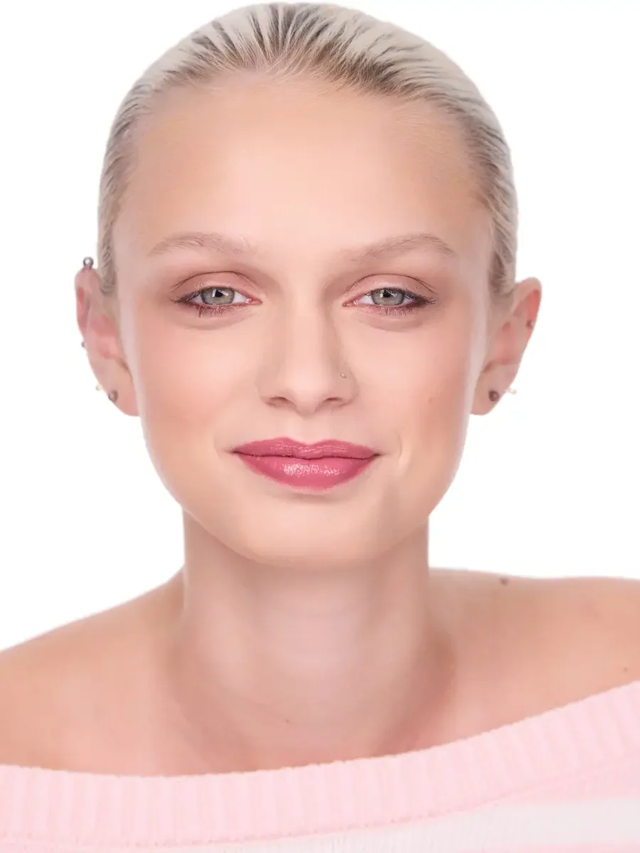 Model portfolio development session, beauty, close-crop, hair slicked back, face forward, soft smile, rose lip, soft eye, pink off-shoulder sweater, white background, photographed by Scott Parker Photo, New York