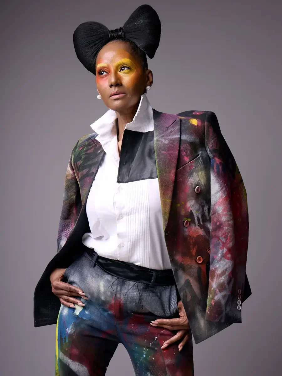 `JUS10H Met Monday 2026, three-quarter view hand-painted suit open with white tuxedo shirt, grey background, photographed by Scott Parker Photo