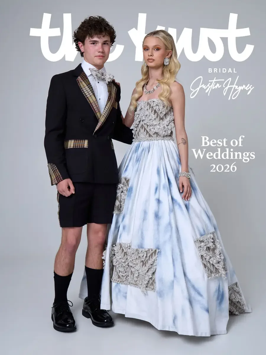 JUS10H 2025 The Knot Bridal feature, Justin Haynes Best of Weddings 2026 cover, ice-blue tie-dye ball gown with strapless textured lace bodice and lace patch appliqués on the skirt alongside black shorts suit with plaid lapels and cuffs, photographed
