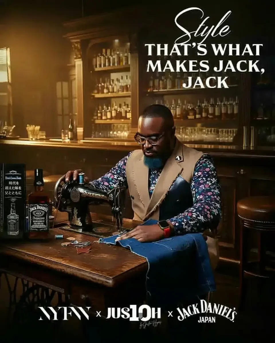 JUS10H 2025 Jack Daniel's Japan cross-promotional campaign, New York Fashion Week, designer at vintage sewing machine in bar interior, floral patchwork vest, photographed by Scott Parker Photo