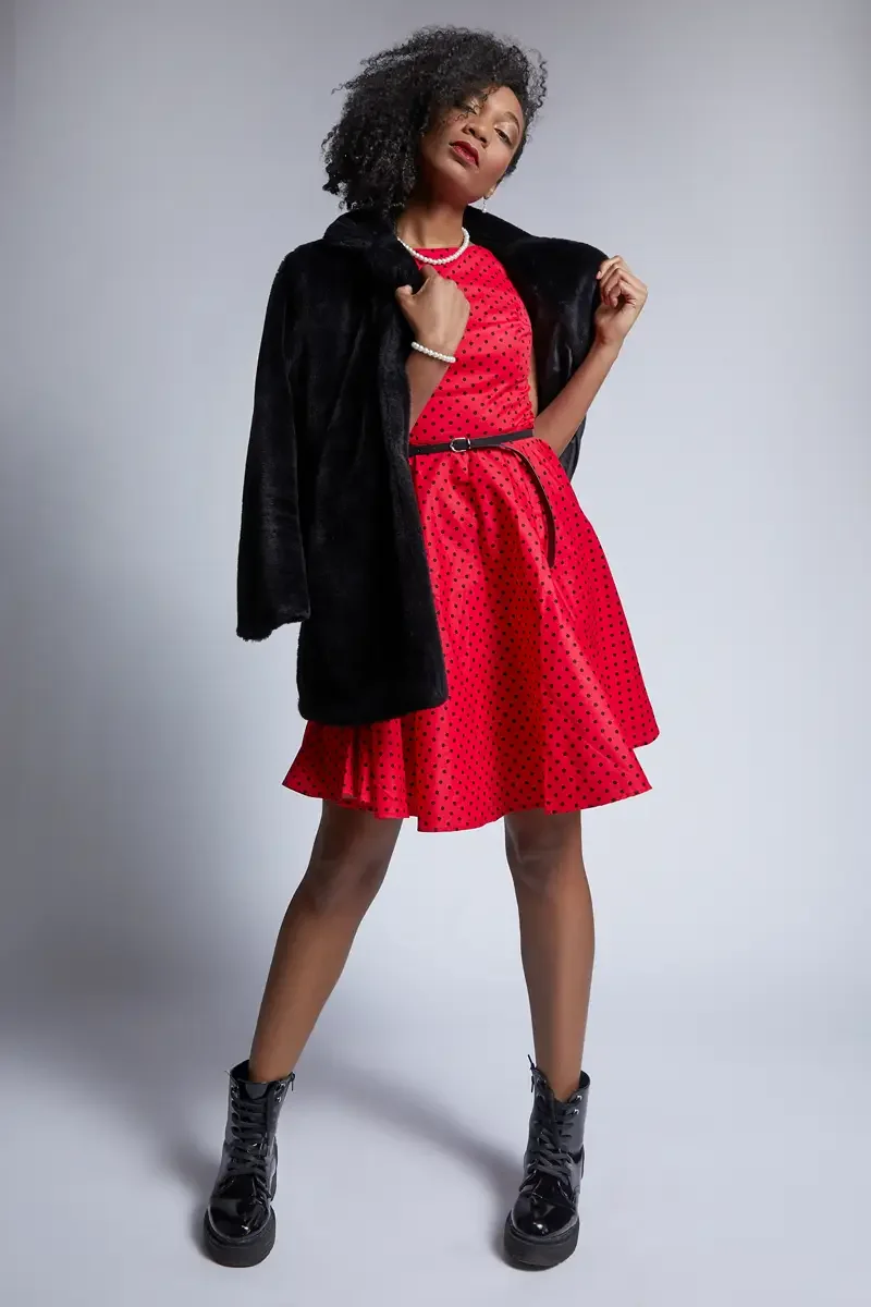 Arielle Chambers, red polka dot dress with skirt movement, black faux fur coat, pearl necklace, platform boots, East Williamsburg studio test shoot, makeup by Schanica Pickens, photographed by Scott Parker Photo