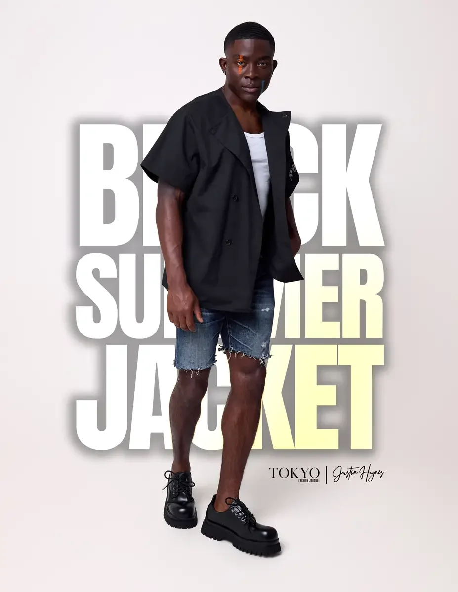 JUS10H Black Summer Jacket lookbook, male model in black short-sleeve jacket worn open over white tee, distressed denim shorts, black lace-up boots, white background, photographed by Scott Parker Photo