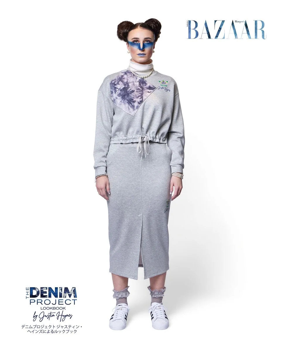 JUS10H Denim Project 2025 Harper's Bazaar Japan lookbook — model in grey tie-dye panel sweatshirt with Adidas Brazil x JUS10H branding and matching grey drawstring midi skirt, blue editorial makeup, Adidas Superstar sneakers, fashion photography by S