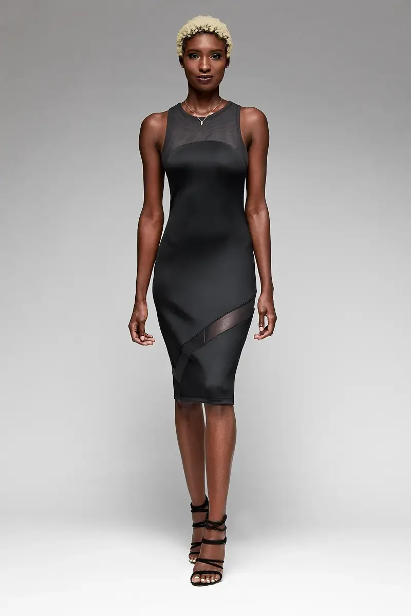 Minika Ko lookbook, black bodycon midi dress, front view, sheer mesh yoke at neckline, diagonal mesh panel insert at skirt, photographed by Scott Parker Photo