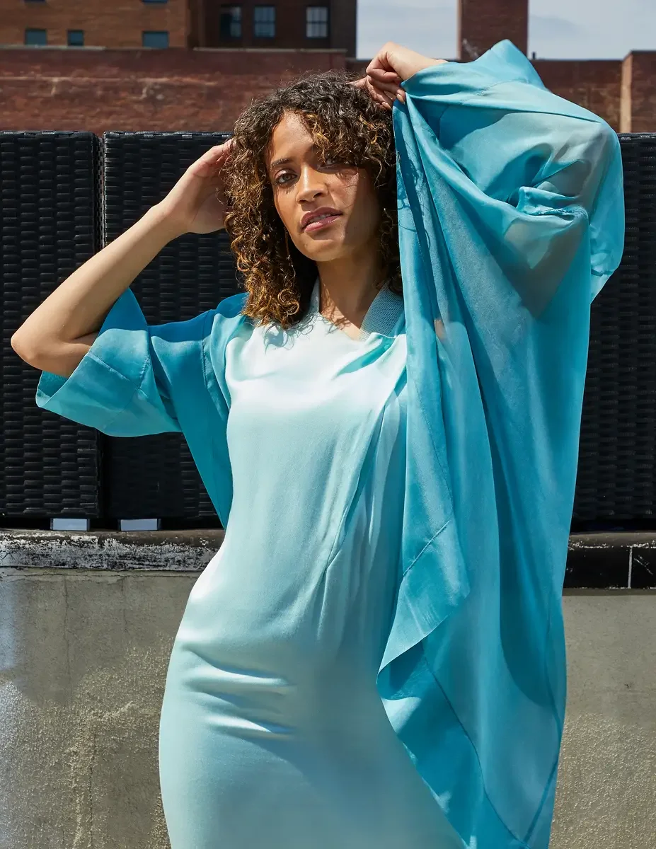 Fashion test shoot, three-quarter, model Ireland T in aqua sleeveless midi dress with turquoise sheer wrap, East Village rooftop, New York City, styling by Matsine Stinson, makeup by Stefani Paige Vivian, photographed by Scott Parker Photo