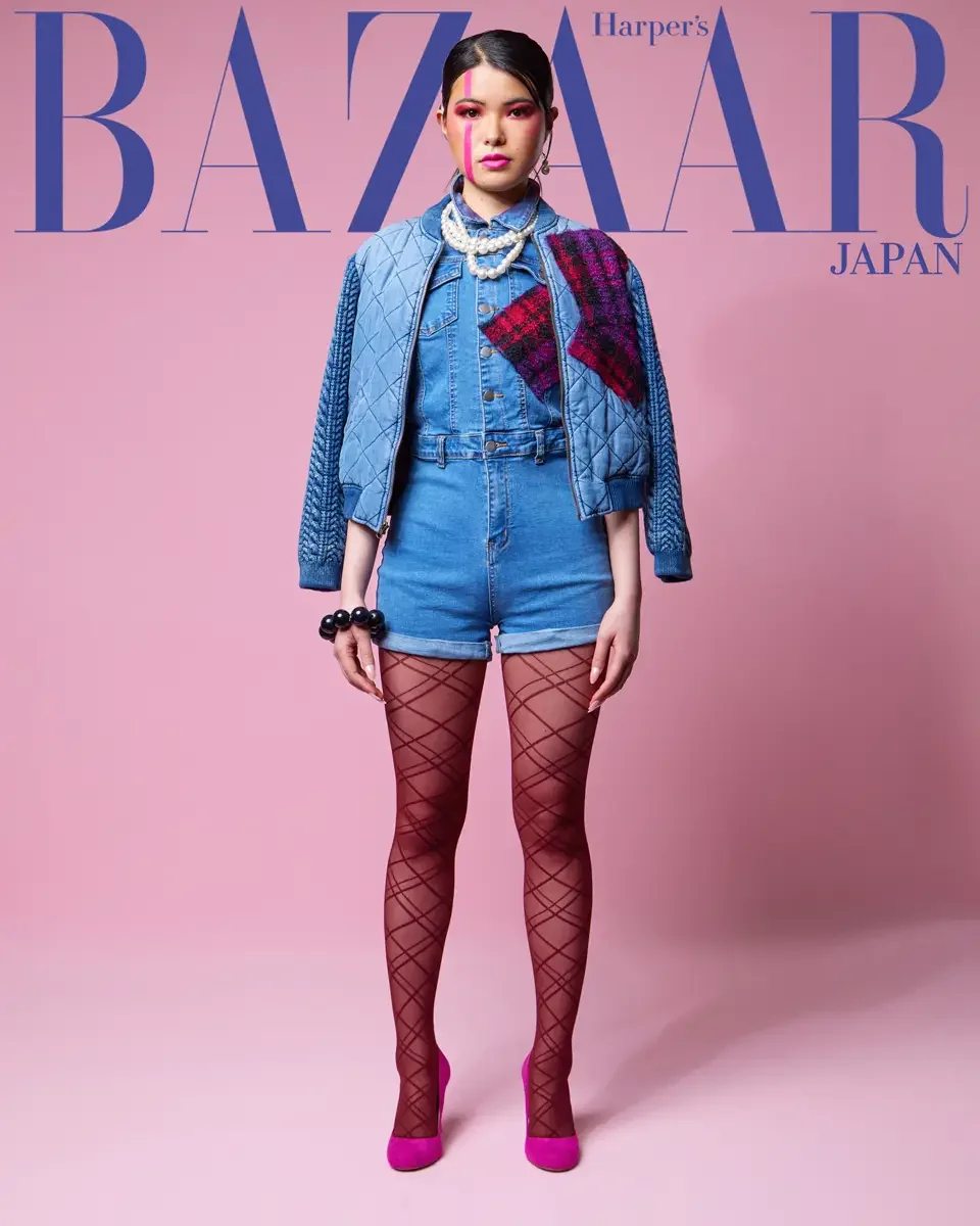 JUS10H 2025 Harper's Bazaar Japan feature, full-length editorial, quilted denim jacket with patchwork detail, denim romper, fishnet tights, pink background, photographed by Scott Parker Photo