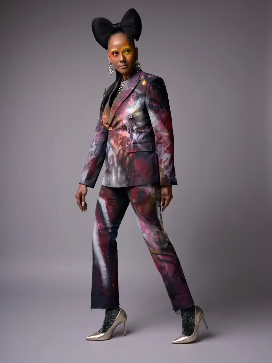 JUS10H Met Monday 2026, full-length hand-painted suit, three-quarter side view, grey background, photographed by Scott Parker Photo