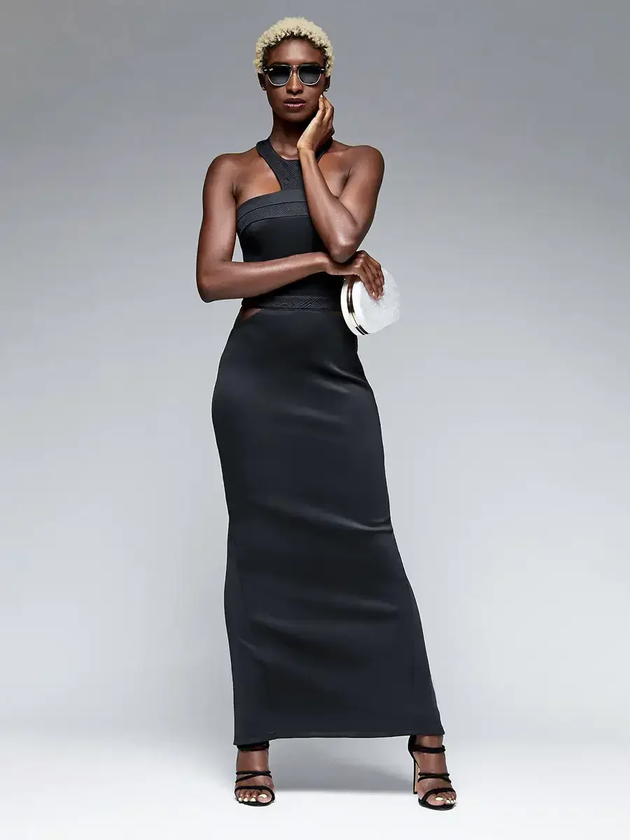 Fashion lookbook photography, black asymmetric halter maxi gown with cutout waist detail, gray background, photographed by Scott Parker Photo