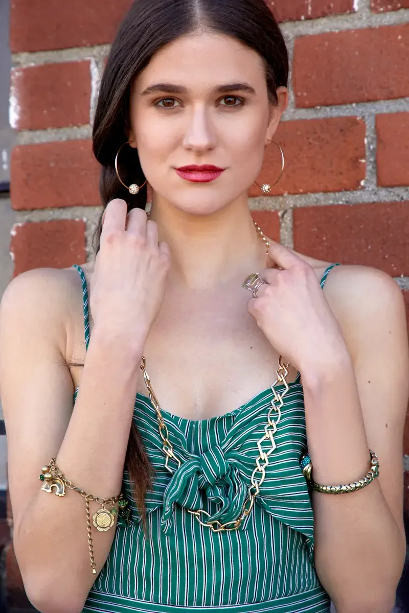 Victoria Henley, gold chain necklace and bracelet detail, green striped jumpsuit, graffiti wall, Los Angeles fashion week test shoot, photographed by Scott Parker Photo