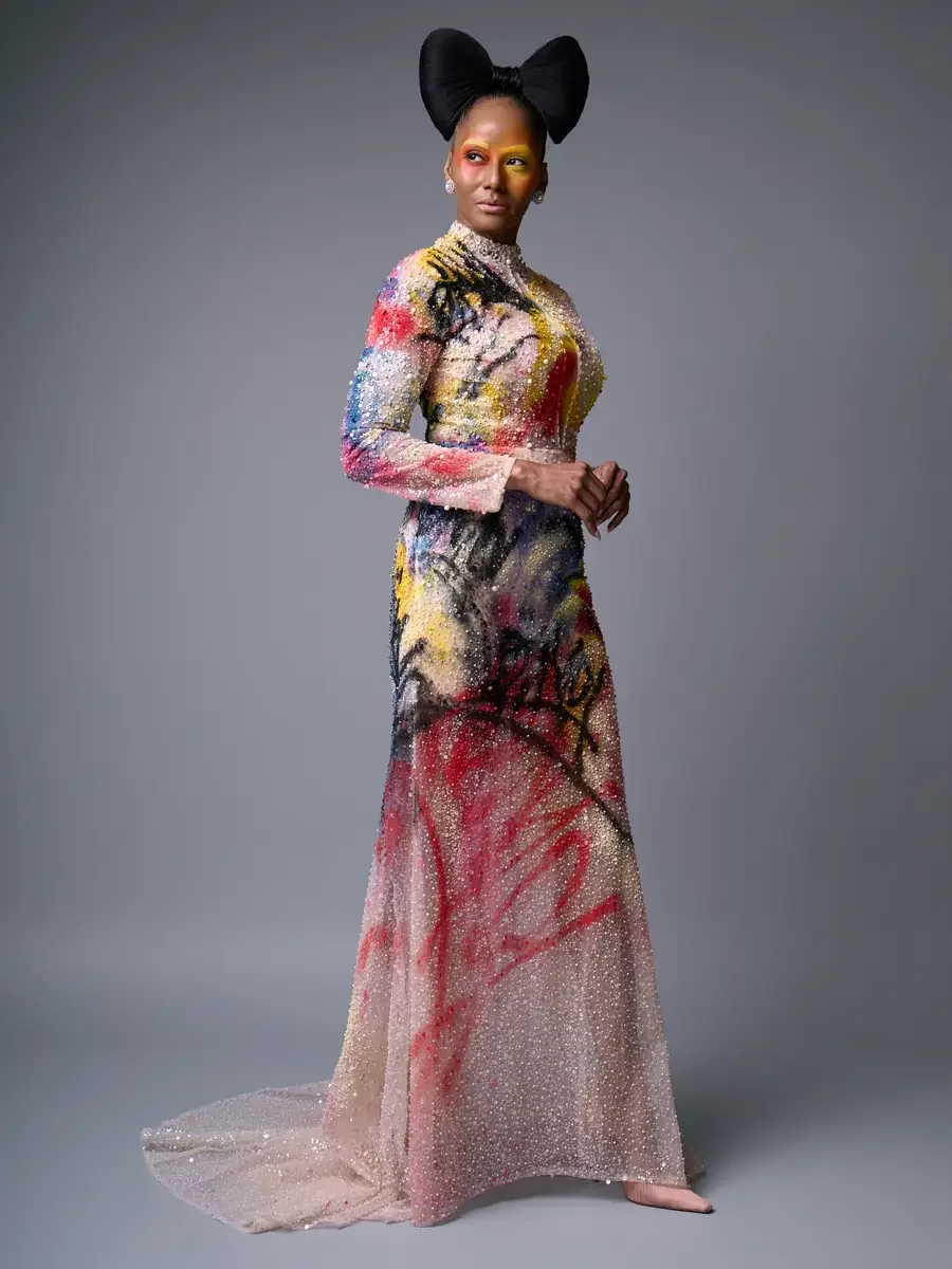 JUS10H Met Monday 2026, three-quarter view hand-painted beaded gown, side profile with train, grey background, photographed by Scott Parker Photo