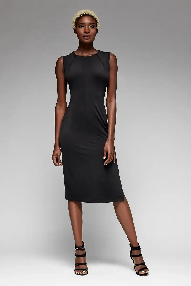 Minika Ko lookbook, black sleeveless bodycon midi dress, front view, crew neckline, angled seam detail at shoulder, fitted smooth synthetic fabric, photographed by Scott Parker Photo