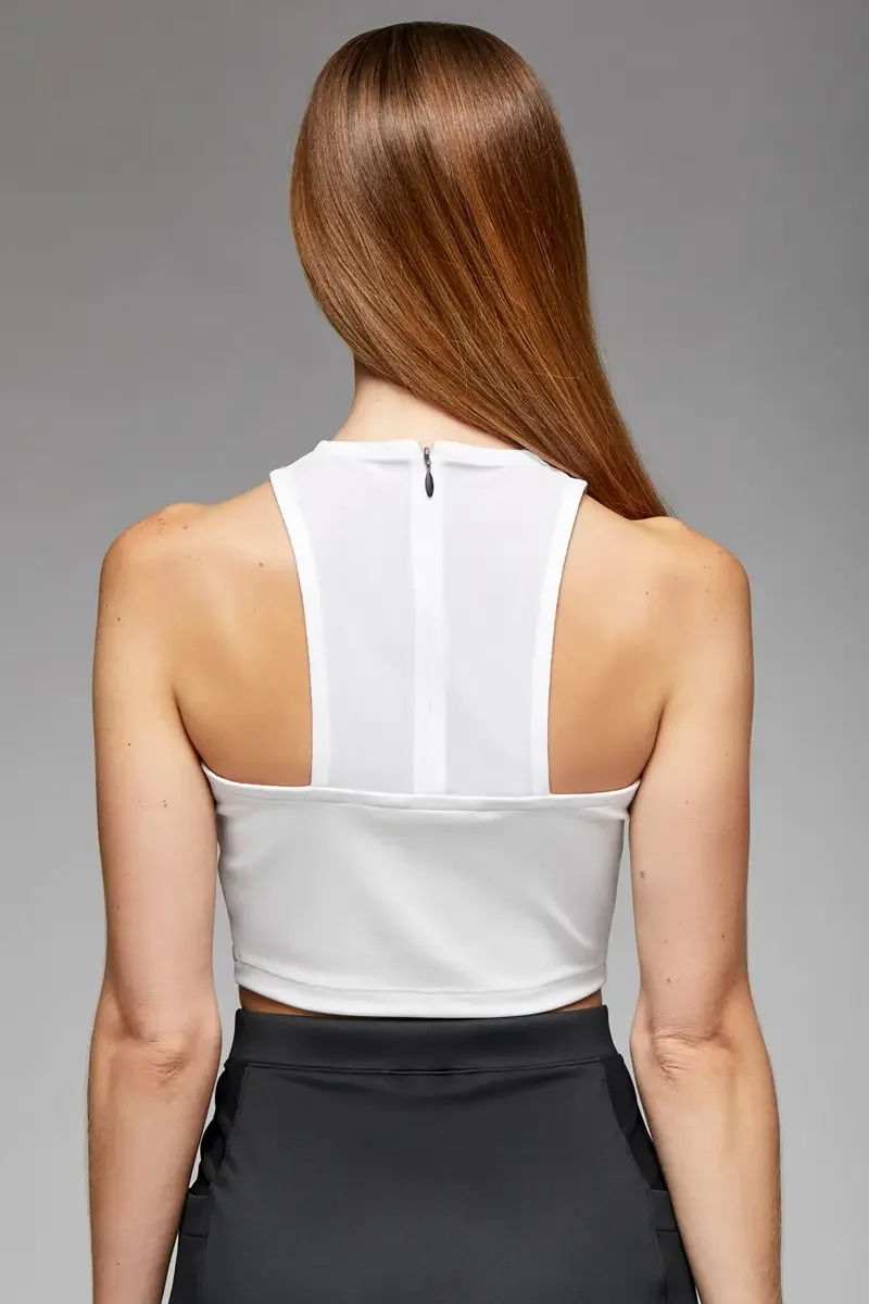 Minika Ko lookbook, white halter crop top, back view, racerback construction with center back zip, clean back panel, paired with black high-waist midi skirt, photographed by Scott Parker Photo