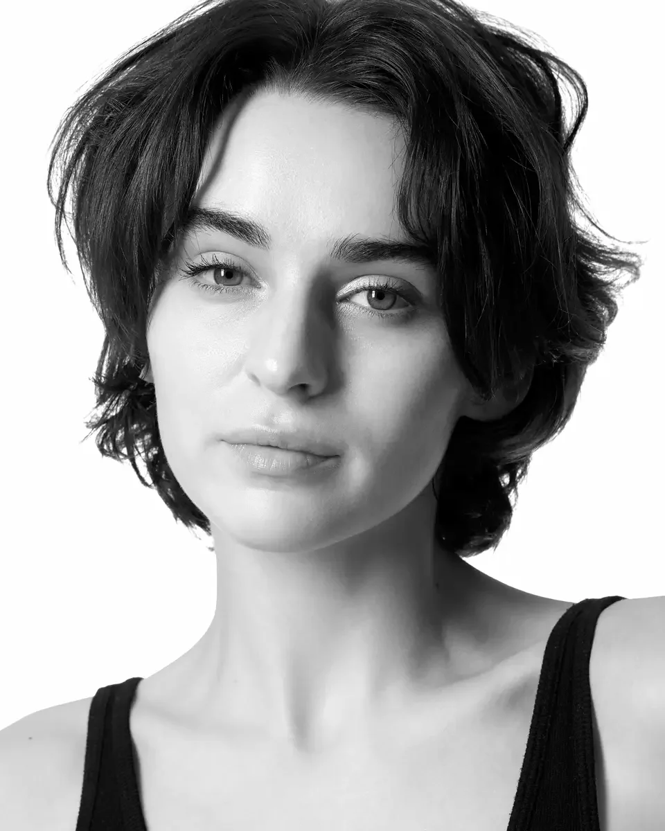 Tess, direct gaze, black tank top, white background, black and white, New York studio test shoot, makeup by Schanica, photographed by Scott Parker Photo