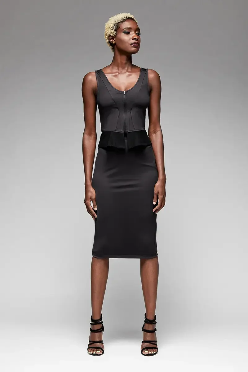 Minika Ko lookbook, black zip-front corset top and fitted pencil skirt, front view, scoop neckline, boning detail at bodice, peplum ruffle at waist, smooth synthetic skirt, photographed by Scott Parker Photo