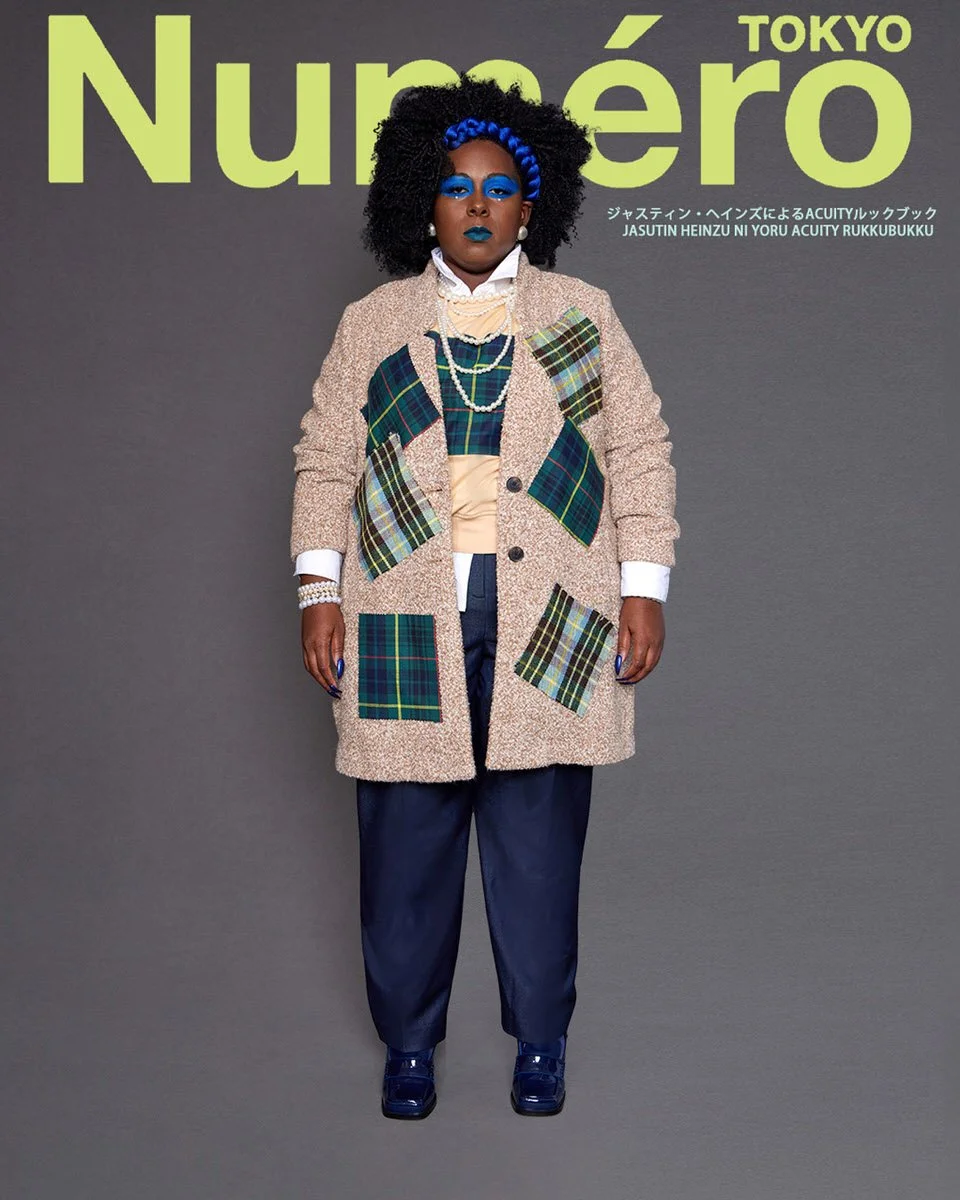 JUS10H by Justin Haynes ACUITY Collection lookbook for Numéro Tokyo by Scott Parker — model in oatmeal bouclé wool overcoat with multi-tartan patchwork pockets, layered over green tartan vest, butter yellow blouse, and white collared shirt, paired wi