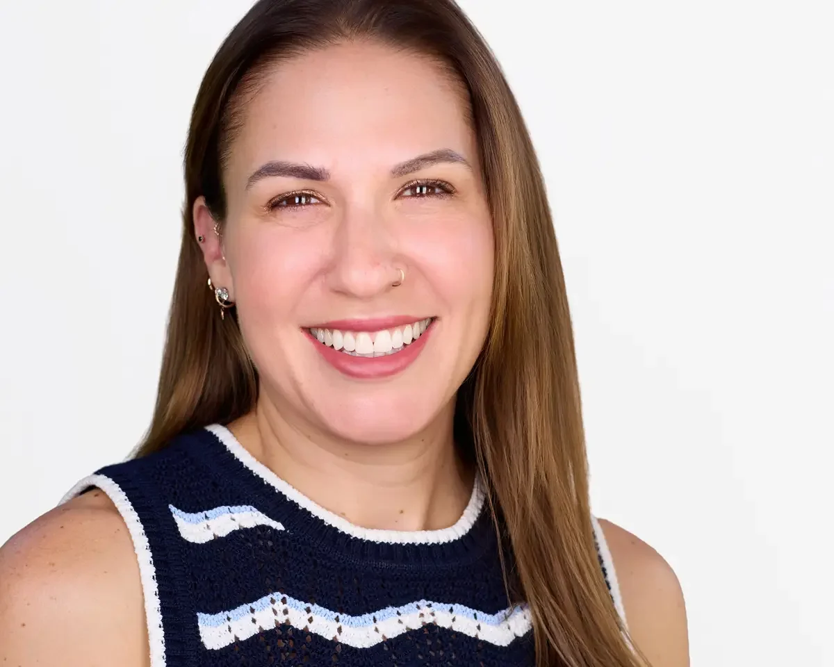 Healthcare professional headshot, navy knit top, genuine smile, approachable expression, white background, Connecticut, photographed by Scott Parker Photo