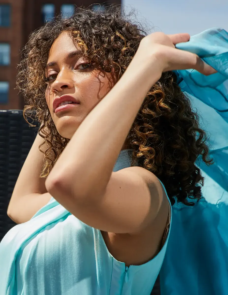 Fashion test shoot, beauty portrait, model Ireland T in aqua sleeveless midi dress with turquoise sheer wrap, East Village rooftop, New York City, styling by Matsine Stinson, makeup by Stefani Paige Vivian, photographed by Scott Parker Photo