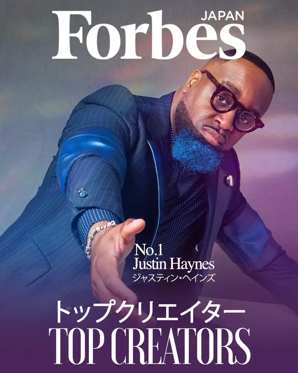 JUS10H 2024 Forbes Japan feature, Top Creators No. 1, editorial cover, navy pinstripe suit with leather detail, dynamic forward pose, photographed by Scott Parker Photo