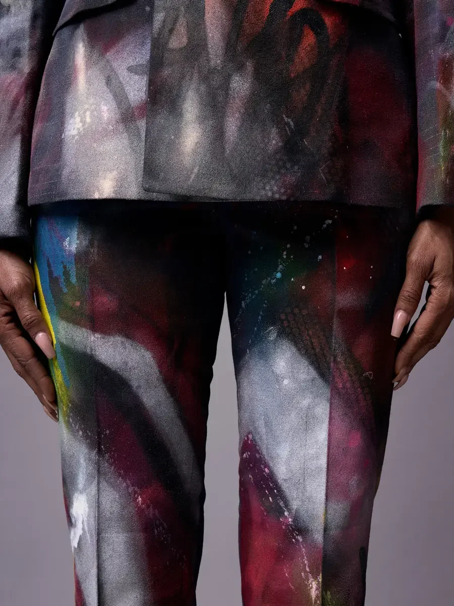 JUS10H Met Monday 2026, trouser and blazer hem detail, hand-painted fabric in charcoal and burgundy, grey background, photographed by Scott Parker Photo