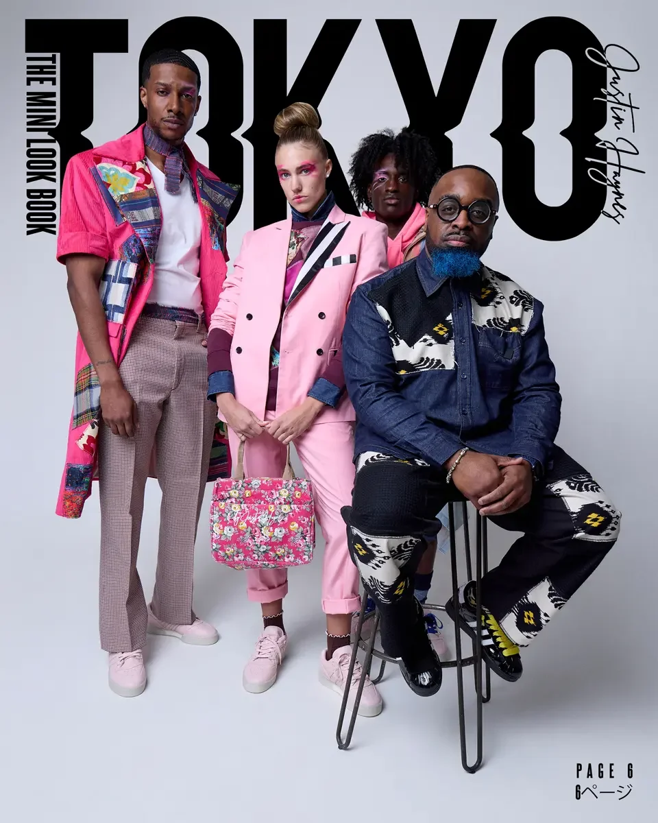 Four diverse individuals dressed in colorful and stylish clothing, posing together for a fashion photo. Background features large black text reading 'TOKYO' with smaller text and a signature.