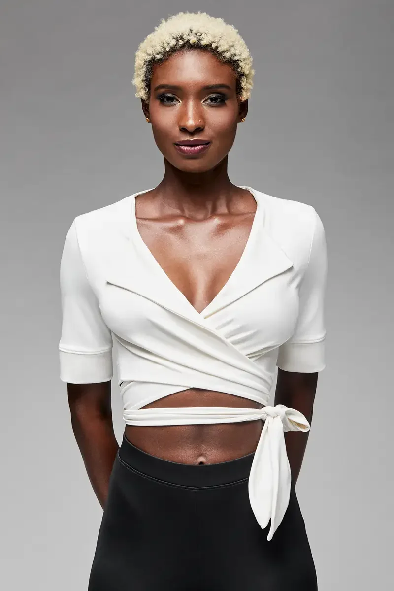 Minika Ko lookbook, detail, white wrap crop top, close crop showing deep V-neckline, lapel detail, and crossover bodice construction, photographed by Scott Parker Photo