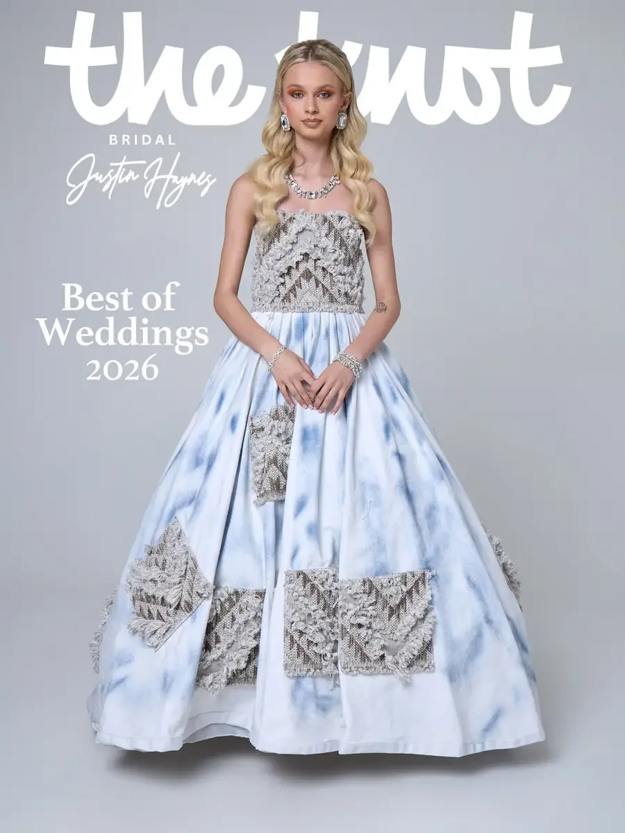 JUS10H 2025 The Knot Bridal feature, Justin Haynes Best of Weddings 2026 cover, ice-blue tie-dye ball gown with strapless textured lace bodice and geometric lace patch appliqués across the full skirt, photographed by Scott Parker Photo