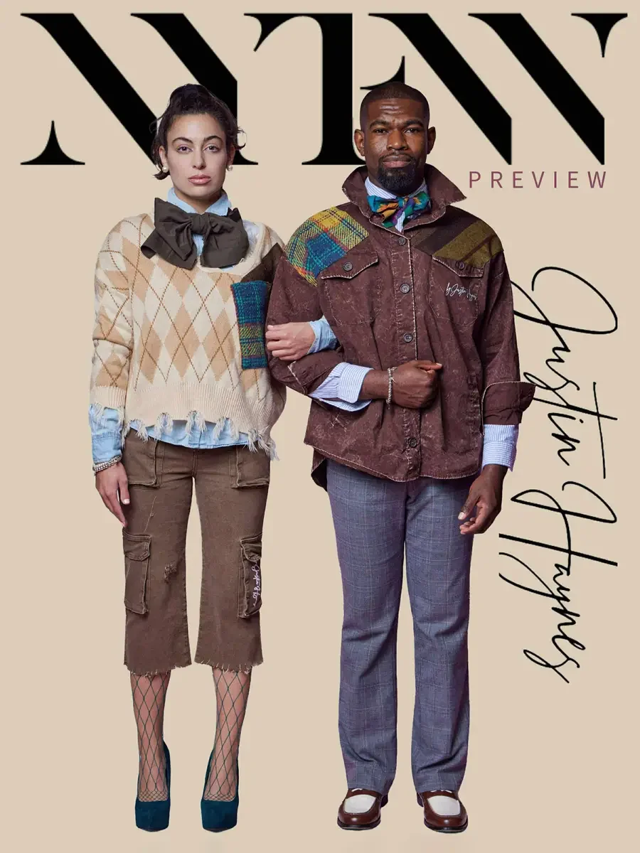 JUS10H 2025 promotional image, cover composition, two models standing together with Justin Haynes script signature, female in camel argyle fringe sweater with olive bow and brown cargo capris, male in brown washed field jacket with multicolor tartan 