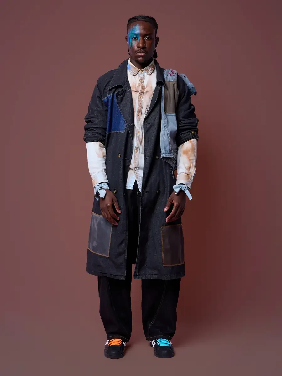 Black denim trench coat over a layered shirt and jet black jeans, JUS10H Court Show lookbook