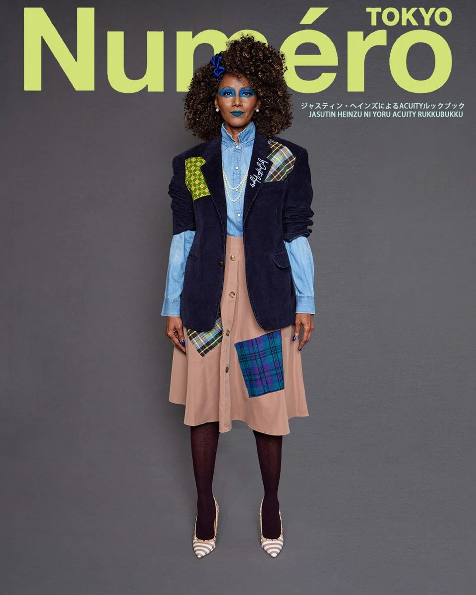JUS10H by Justin Haynes ACUITY Collection lookbook for Numéro Tokyo by Scott Parker — model in navy corduroy blazer with green checkered and tartan patchwork detail, layered over chambray button-down and tan corduroy midi skirt with plaid patch pocke