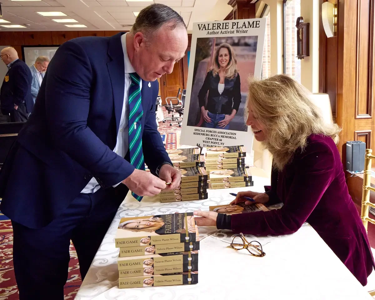 Nonprofit event photography, book signing with attendee and featured speaker, Litchfield County Connecticut, photographed by Scott Parker Photo