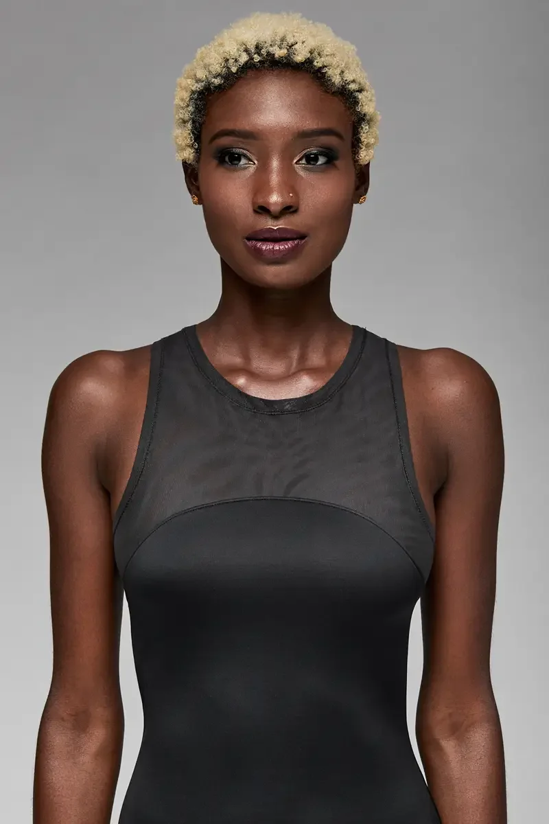 Minika Ko lookbook, detail, sheer mesh yoke at neckline of black bodycon dress, close crop showing neckline and upper bodice construction, photographed by Scott Parker Photo