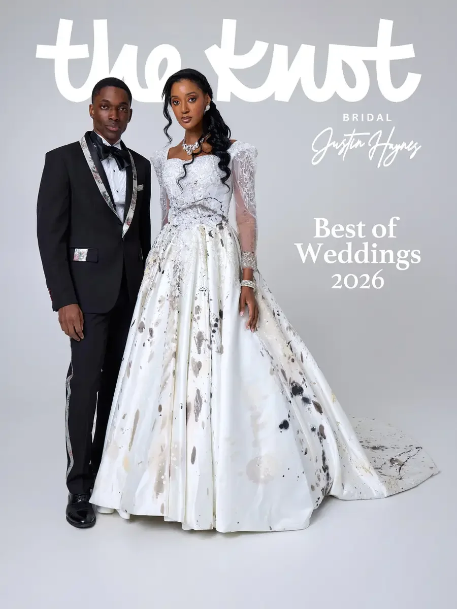 JUS10H 2025 The Knot Bridal feature, Justin Haynes Best of Weddings 2026 cover, white abstract paint-splatter ball gown with beaded sweetheart bodice and sheer long sleeves alongside black tuxedo with floral-print lapels and matching side stripe, pho