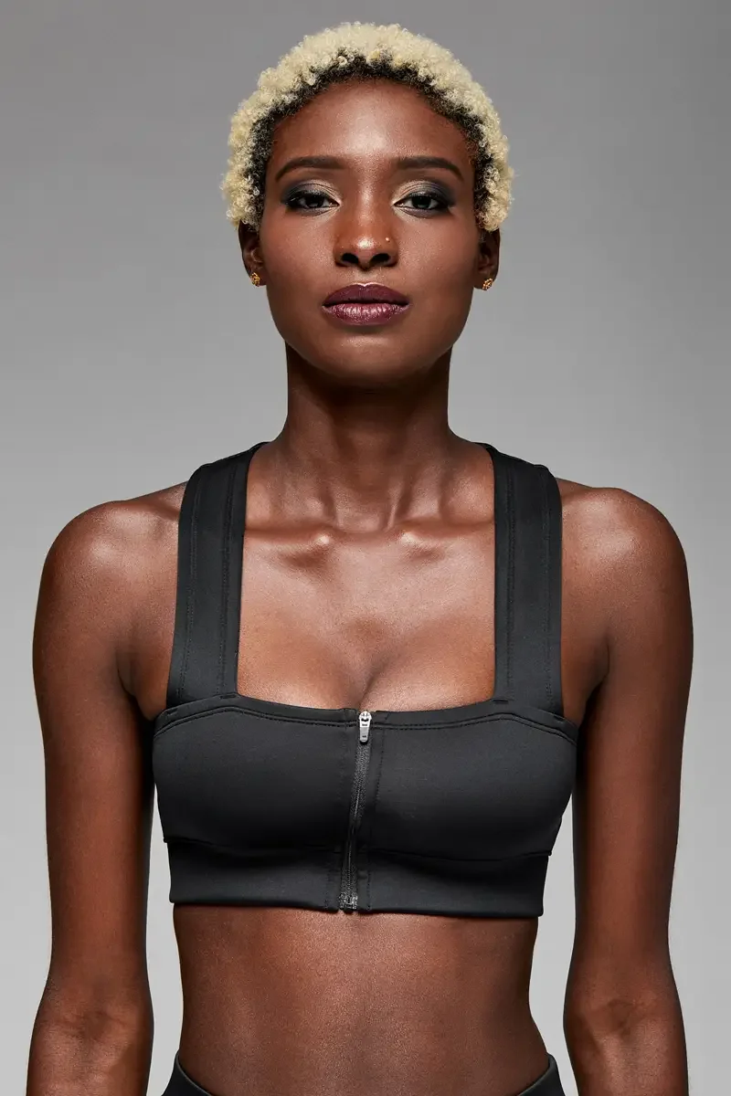 Minika Ko lookbook, detail, racerback panel of black zip-front crop top, smooth synthetic fabric, seam construction at center back, photographed by Scott Parker Photo