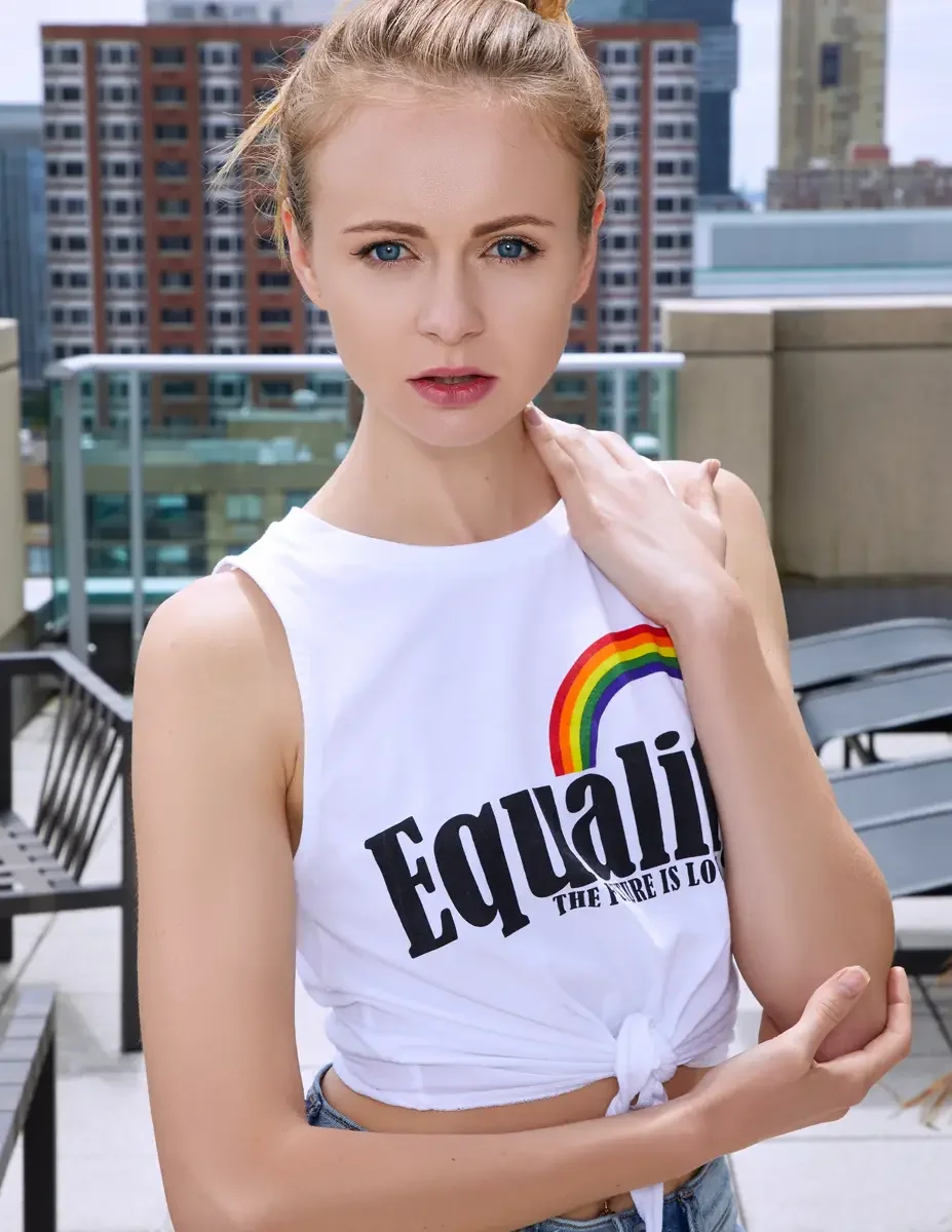 julia-23-test-shoot-new-york-2018-scott-parker-photo-close-up-portrait-rooftop-black-fringe-jacket-hair-up-bun.webp