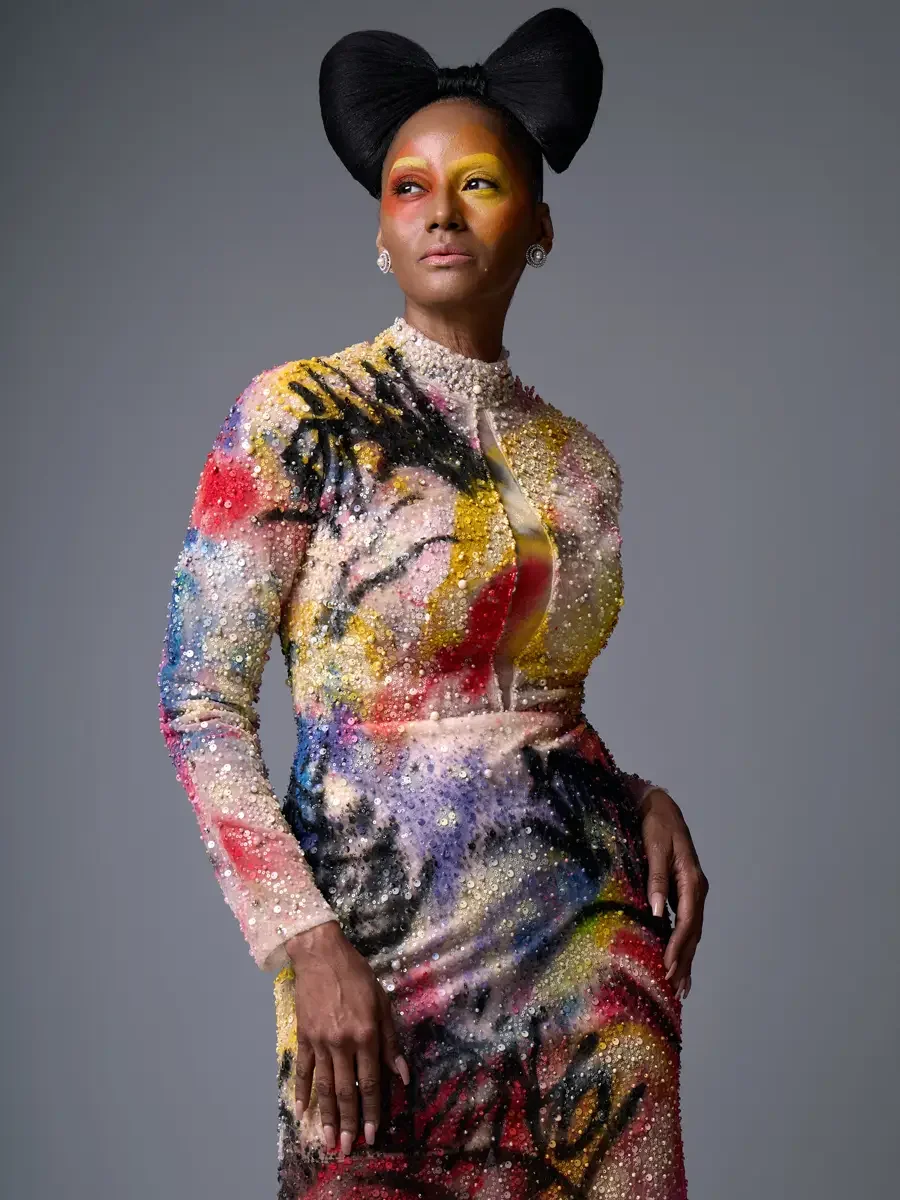 JUS10H Met Monday 2026, three-quarter view looking upward, hand-painted beaded gown with train, grey background, photographed by Scott Parker Photo