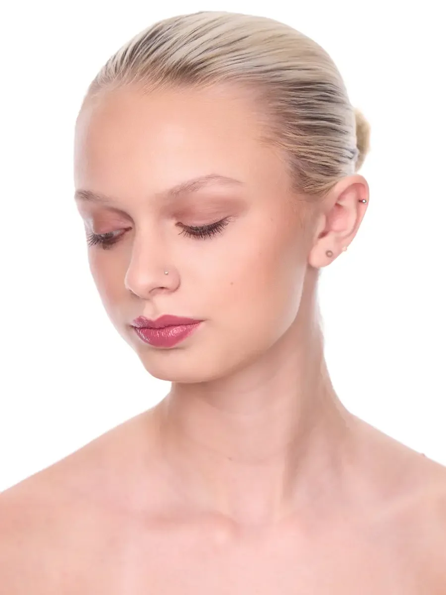 Model portfolio development session, beauty, close-crop, hair slicked back, three-quarter turn, eyes closed, rose lip, soft eye, bare shoulders, white background, photographed by Scott Parker Photo, New York