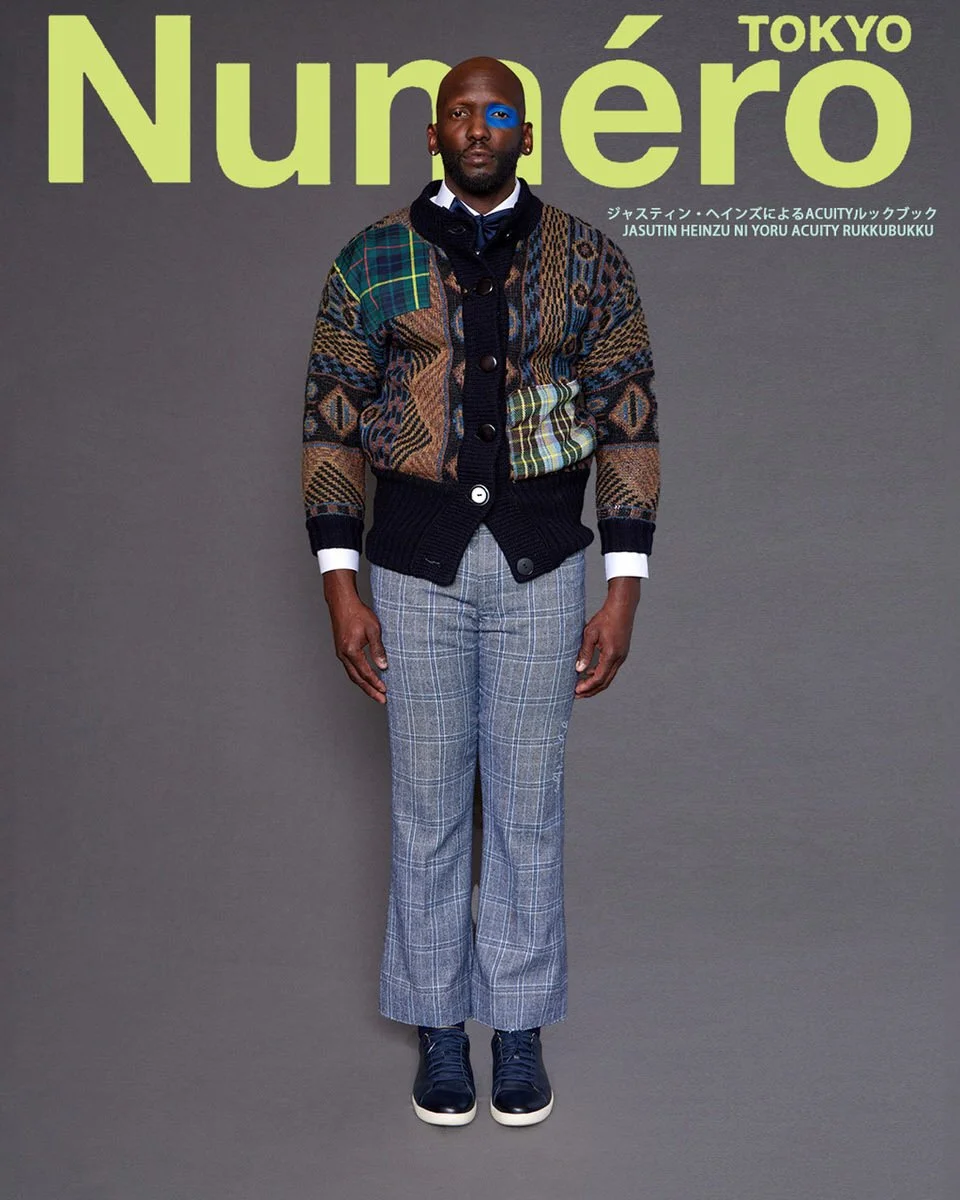JUS10H by Justin Haynes ACUITY Collection menswear look for Numéro Tokyo by Scott Parker — male model in geometric jacquard knit cardigan with tartan and checkered patchwork detail and contrast navy ribbed trim, layered over white button-down and nav