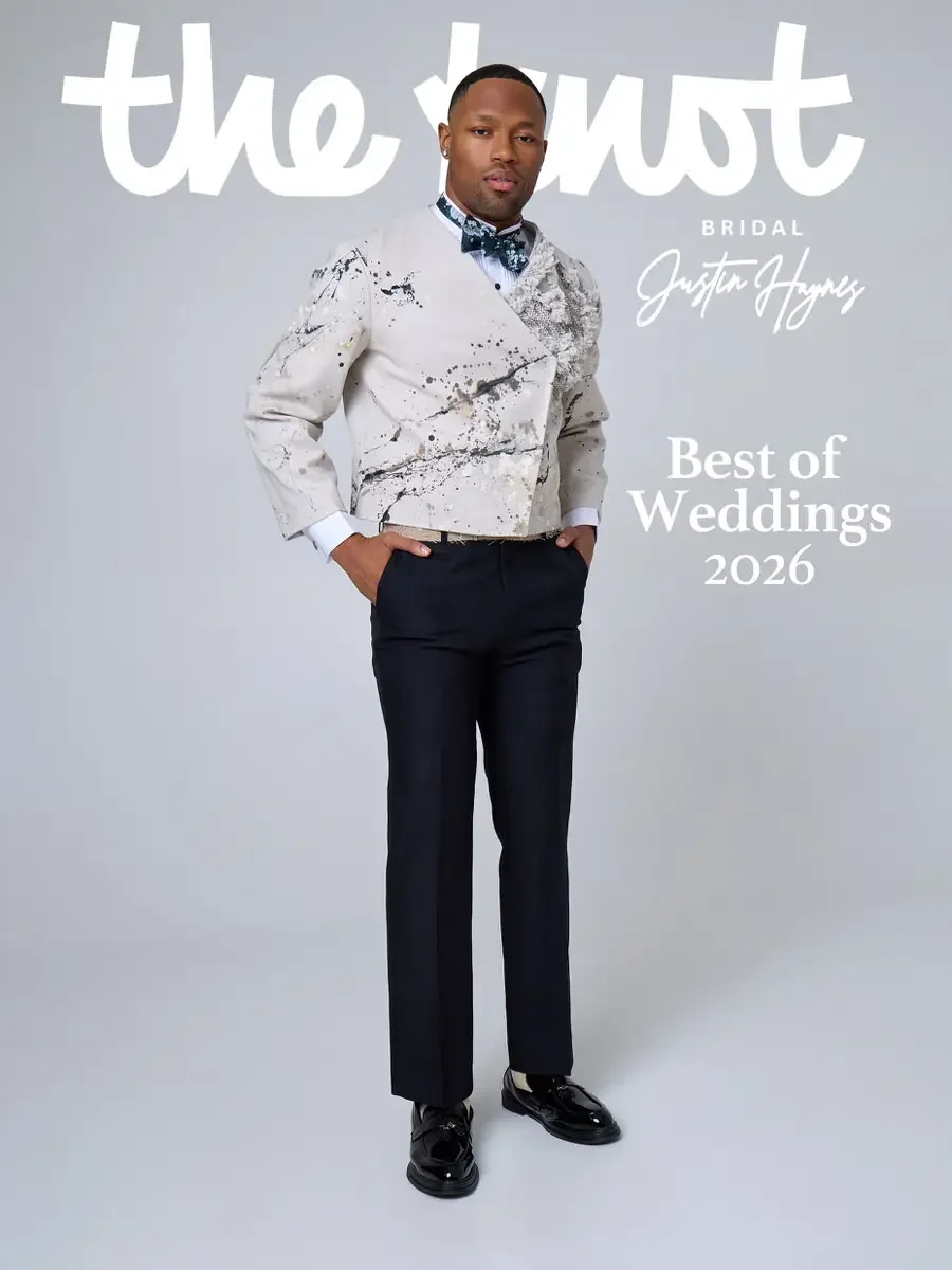 JUS10H 2025 The Knot Bridal feature, Justin Haynes Best of Weddings 2026 cover, ivory abstract paint-splatter tuxedo jacket with dark teal floral bow tie and black trousers, styled with black patent leather loafers, photographed by Scott Parker Photo
