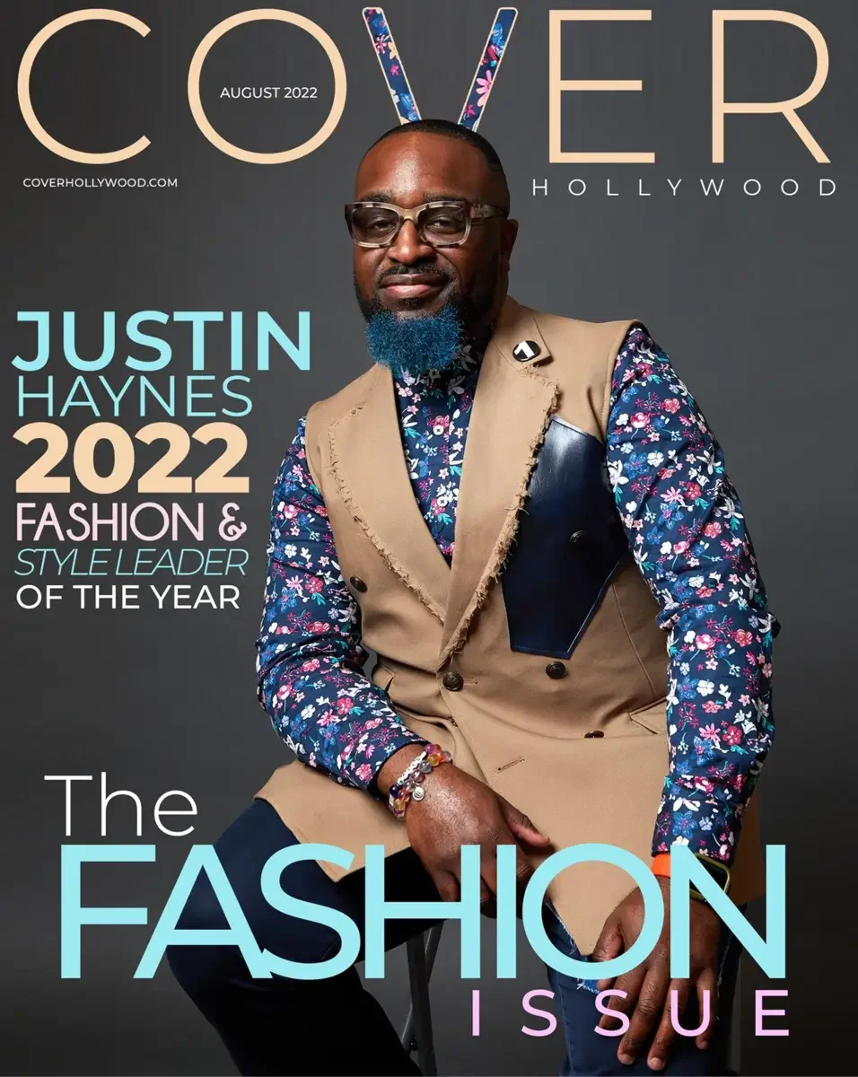 JUS10H 2022 Cover Hollywood feature, Fashion and Style Leader of the Year, tan vest over floral blazer, seated editorial portrait, photographed by Scott Parker Photo