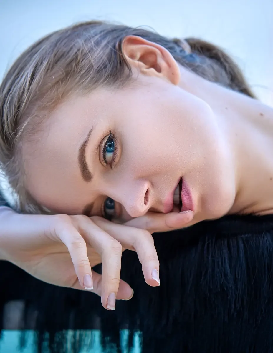 ulia, close-up portrait, hair up in a loose bun, black tiered fringe jacket with zip front, Jersey City rooftop test shoot, photographed by Scott Parker Photo