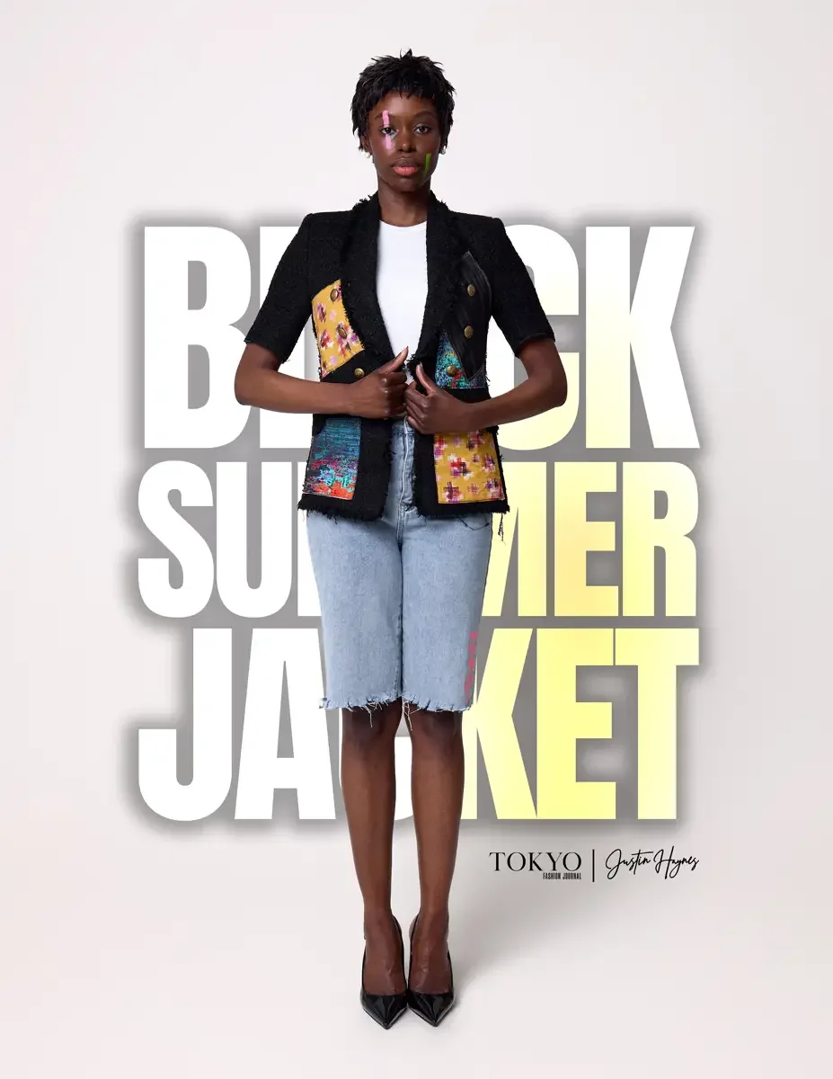 JUS10H Black Summer Jacket lookbook, female model in black tweed short-sleeve jacket with multicolor patchwork panels and gold buttons, white tee, light-wash denim bermuda shorts, black heels, white background, photographed by Scott Parker Photo