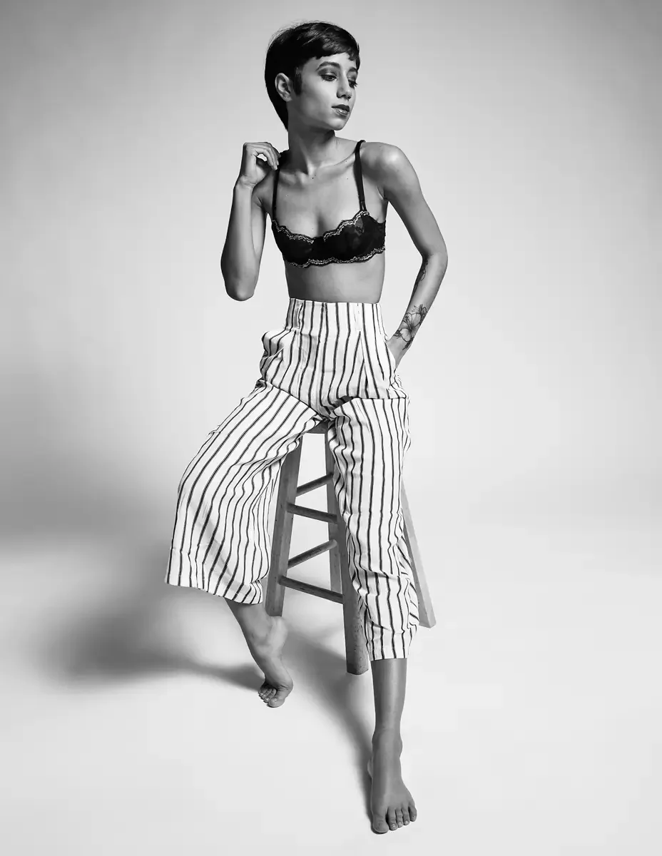 Eloissa, black and white, standing lean, black lace bralette and high-waisted striped wide-leg trousers, studio stool, East Williamsburg studio test shoot, makeup by Schanica Pickens, photographed by Scott Parker Photo