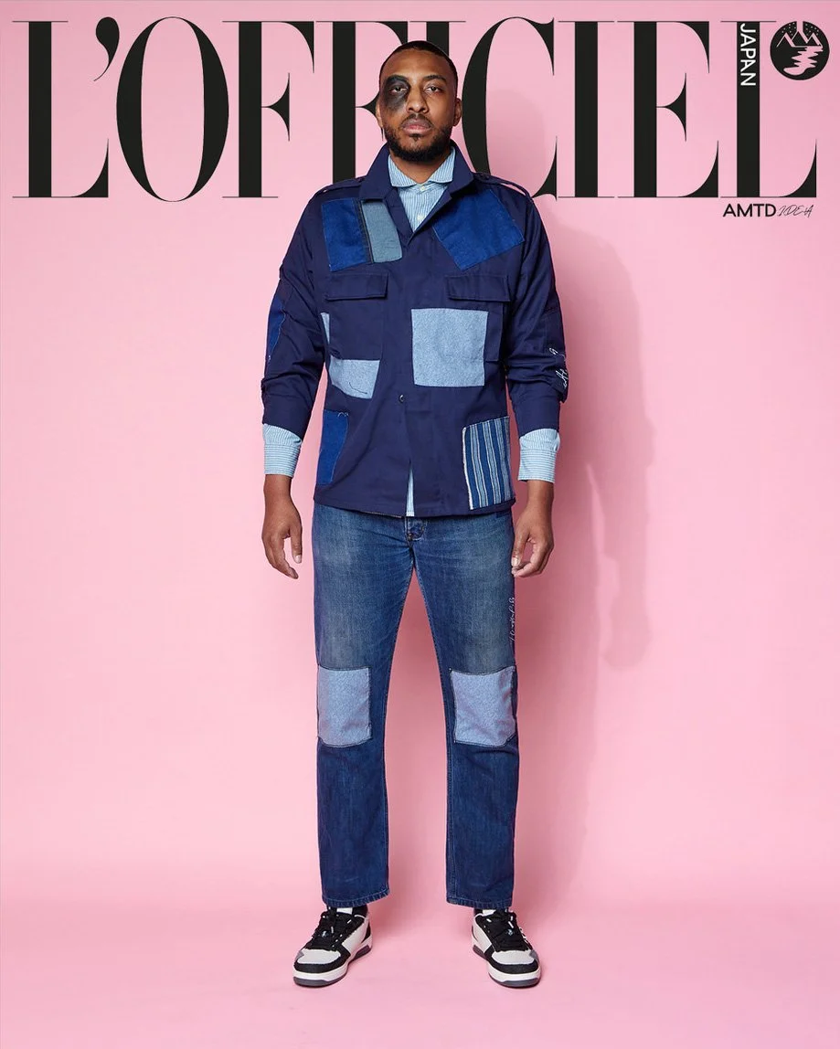 

JUS10H Tokyo Remote Collection NYFW 2025 — model Kenpachi in navy multi-pocket military-style patchwork jacket with light-wash denim, corduroy, and stripe fabric panels over a blue stripe shirt, paired with dark indigo straight-leg jeans with light