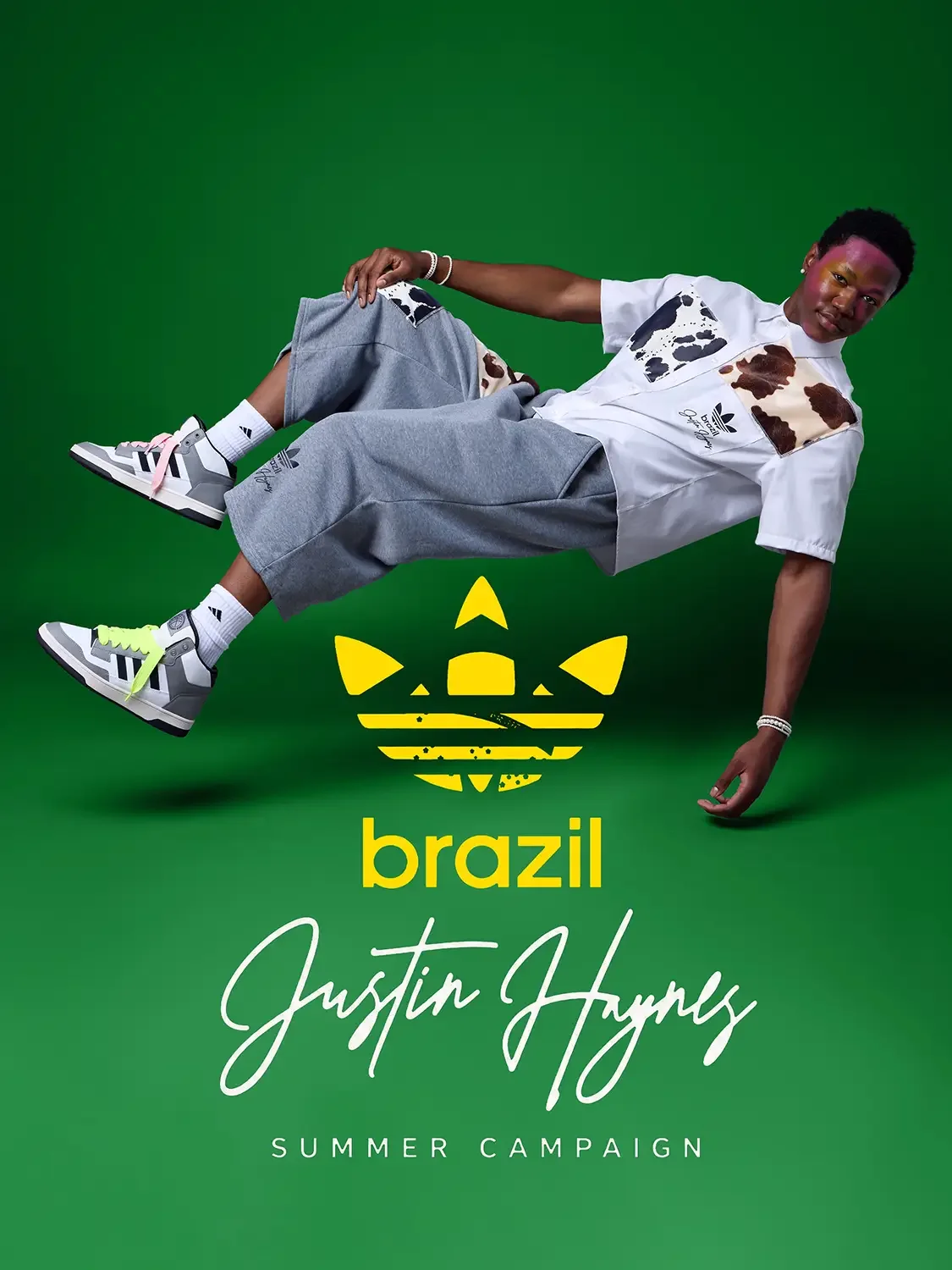 Adidas Brazil 2026 World Cup campaign, Caleb suspended low to the ground in a cow-print shirt, Brazil green background and yellow logo, photography by Scott Parker Photo for JUS10H by Justin Haynes
