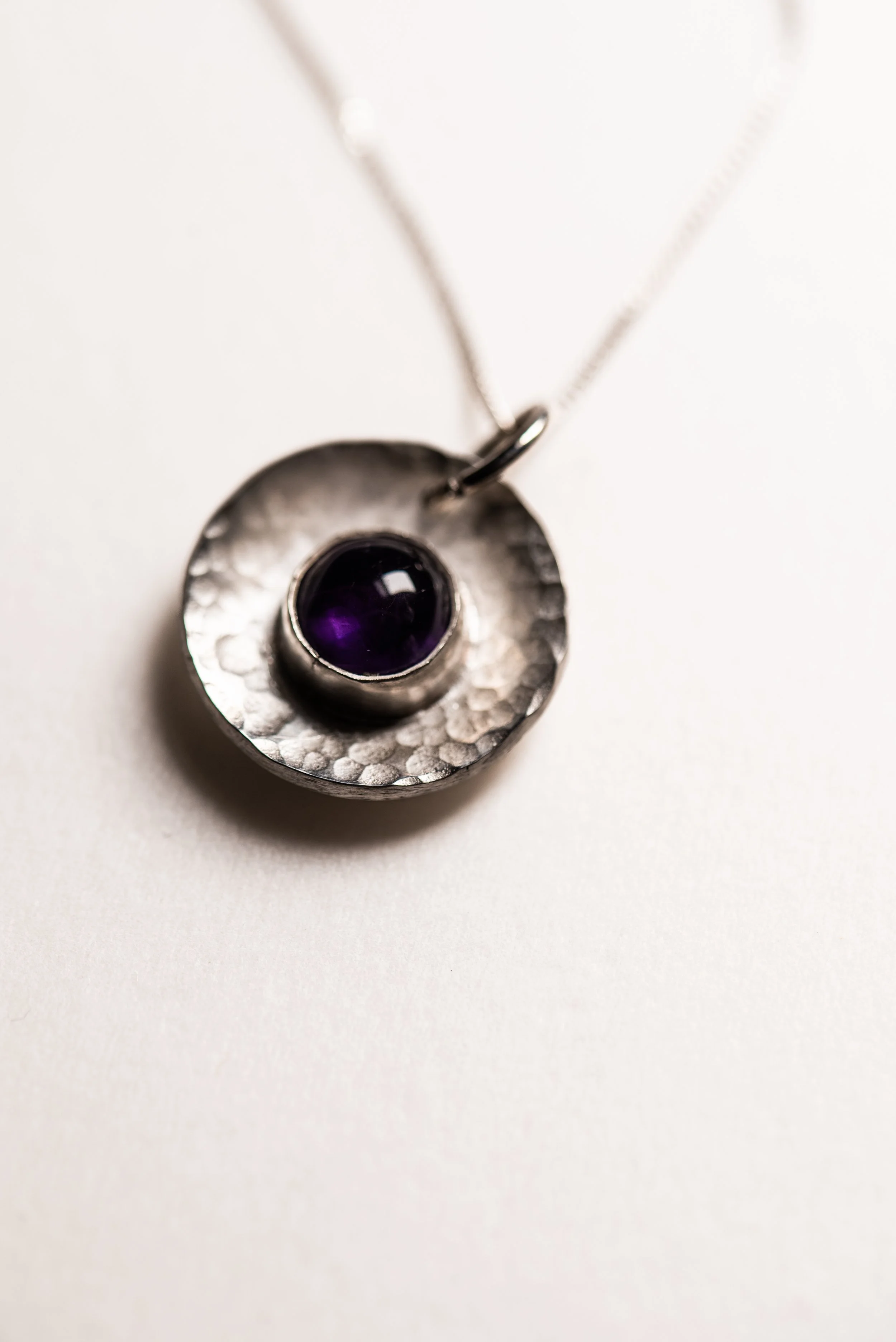 Textured silver pendant necklace with gemstone