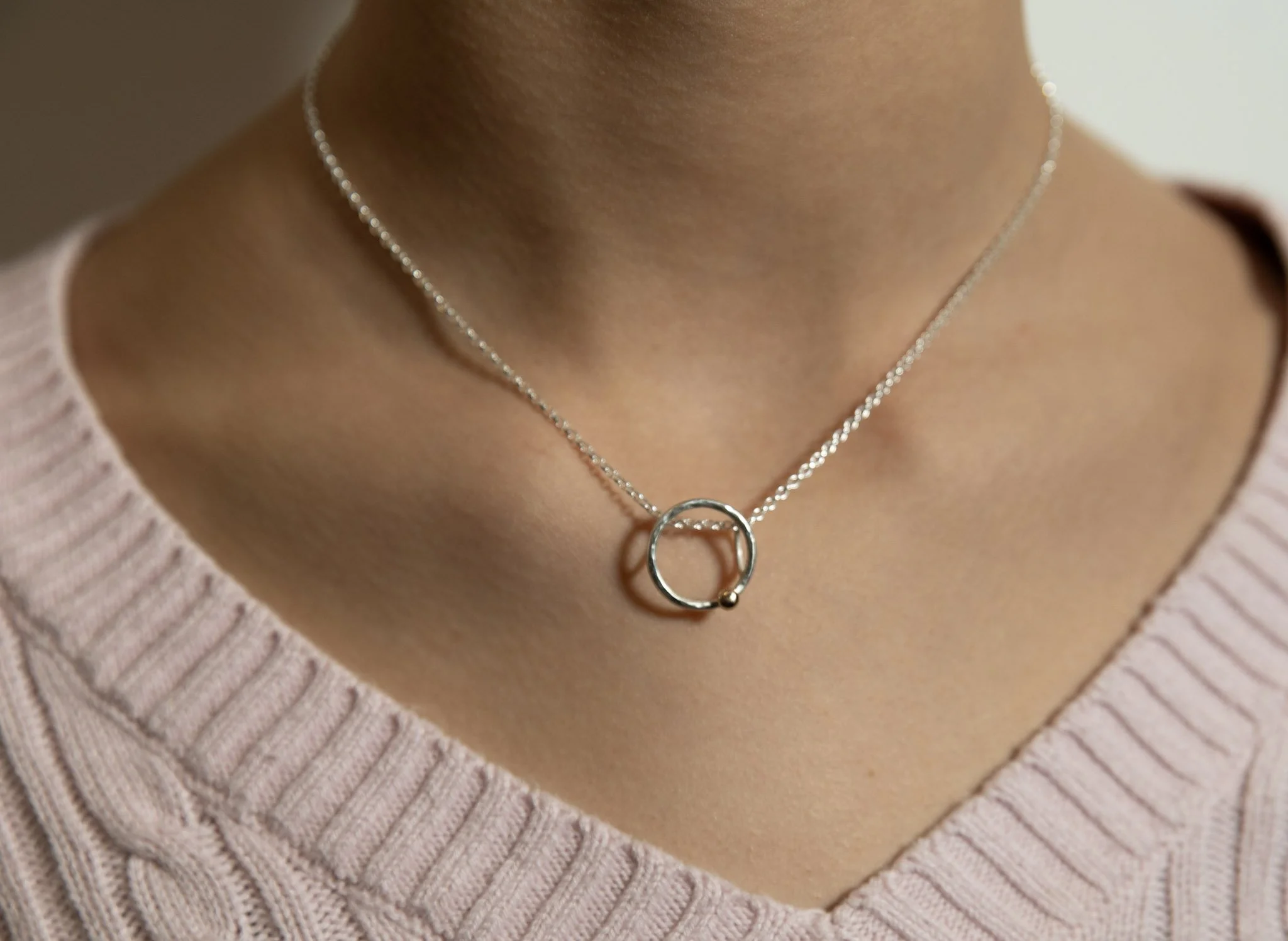 Silver "Minerva" necklace and pendant, hammered hoop with gold granulation detail